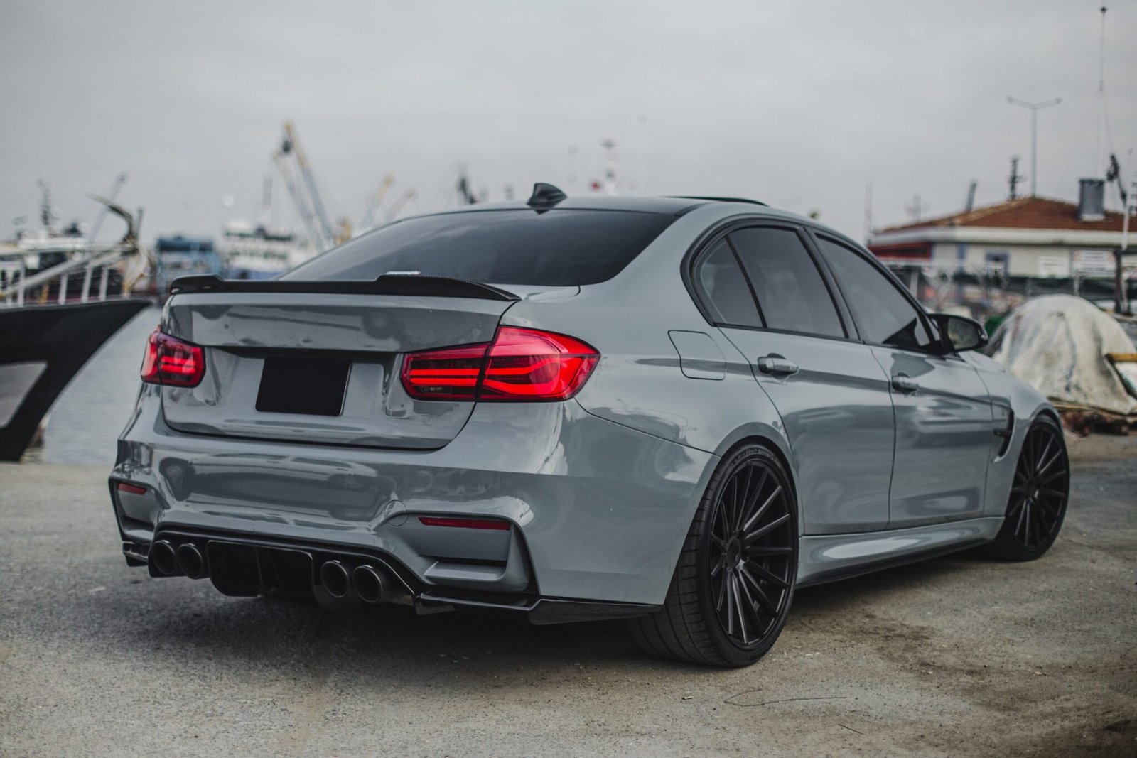 silver-sedan-with-red-lights-parked-port-scaled.jpg