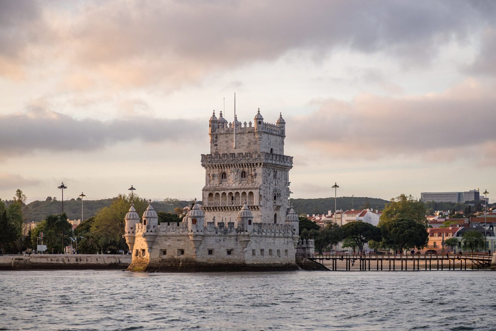 tower-belem-surrounded-by-sea-buildings-cloudy-sky-portugal-scaled.jpg